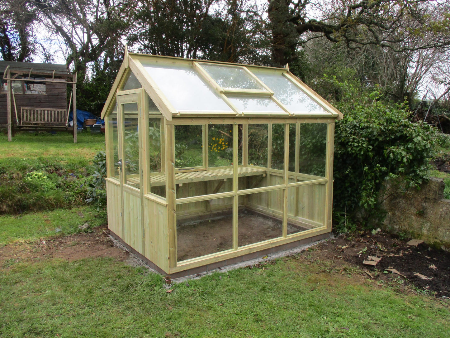 The Greenhouse (3-sides boarded 1-side glass)